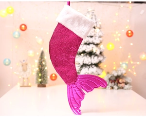 Close-up of a mermaid tail Christmas stocking with pink sequins and white faux fur trim