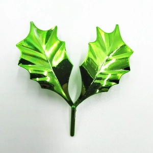 Green metallic festive holly leaf cake topper decoration for Christmas parties