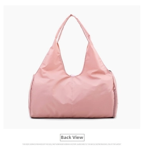 Detailed back view of large pink waterproof travel bag with durable nylon handles