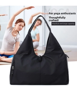 Macro detail of spacious black yoga travel bag with waterproof nylon texture and zip pocket