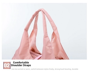 Close-up of durable reinforced shoulder strap stitching and pink zipper on travel bag