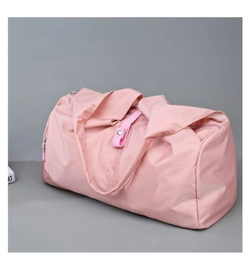 Close-up of pink large capacity yoga travel bag with reinforced handles and snap closure