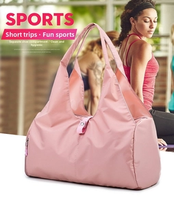 Pink waterproof travel bag detail featuring a dedicated shoe compartment for gym