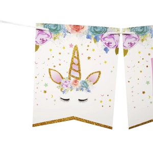 Unicorn happy birthday banner with glitter gold horns and pastel floral party decorations