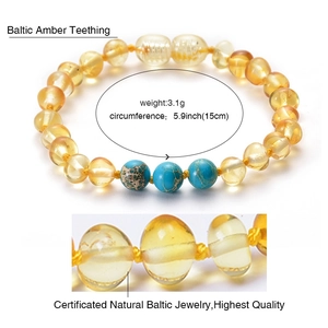 Baltic amber baby bracelet with turquoise beads on a white background and close-up detail