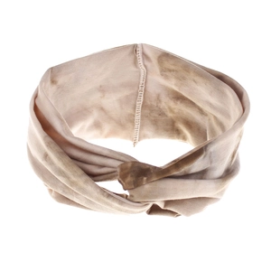 Macro detail of bohemian tie-dye elastic headband showing soft knit fabric and knot design