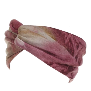 Detail of bohemian tie-dye wide headband featuring a stylish central knot and soft fabric