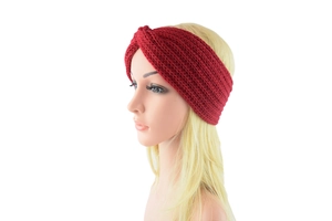 Detailed texture of dark red knitted headband with a stylish crossover knot design