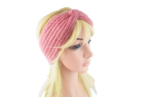 Detail of pink knitted cross headband on mannequin showing winter wool texture