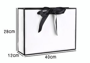 White minimalist paper gift bag with black trim and ribbon, size 40x12x28cm detail