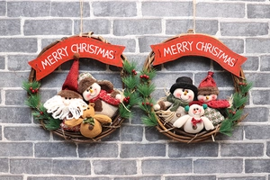 Detail of Christmas wreath with Santa, Snowman and Reindeer on rustic rattan base