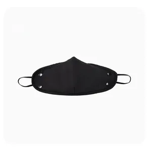 Detail of black winter thermal mask with metal snap buttons and adjustable ear loops