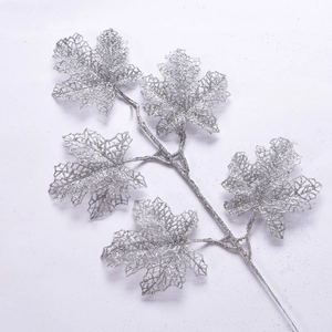 Glittery silver hollow artificial leaves for Christmas tree decoration from a 45-degree angle