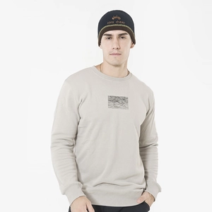 Close-up of cool cheer embroidery and brown stripes on the knitted beanie hat detail