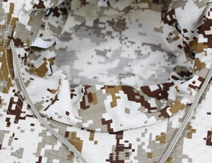 Detail of desert camo boonie hat interior with chin strap and breathable vents