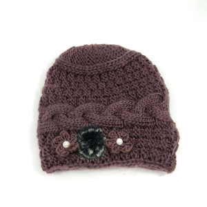 Winter knit hat for women featuring plush lining, crochet flowers and faux fur pom-pom