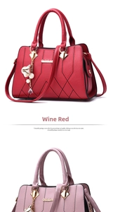 Detail of wine red and lavender tote bags with V-shaped quilting and pearl tassels