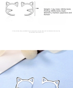 Macro view of minimalist cat ear studs with platinum plating and 10mm size detail