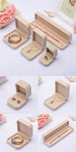 Detailed views of premium beige velvet jewelry gift boxes for rings and necklaces