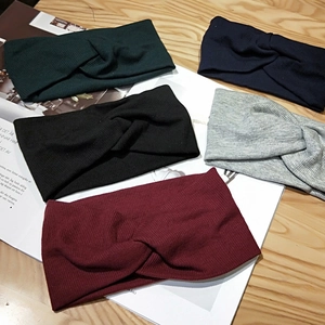 Knitted cross knot headbands in multiple colors including green navy black and grey