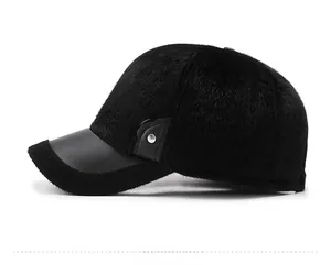 Detail view of winter baseball cap with black faux fur and leather brim