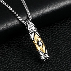 Detailed shot of bullet cylinder pendant with gold hexagram on steel box chain