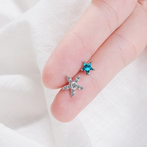 Asymmetric blue star stud earrings with silver pavé cubic zirconia accents for women
