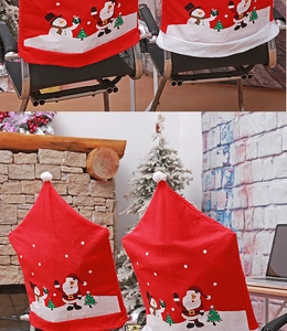 Detail of red velvet Christmas chair covers featuring Santa and snowman patterns