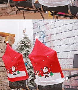 Detail of red Christmas chair covers with Santa and snowman patterns in a festive room