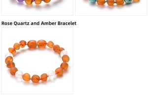 Detail view of pink crystal and orange amber bead bracelet with soft pink cord