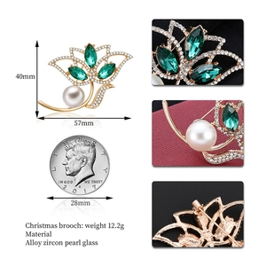 Elegant gold flower brooch featuring green zircon petals and white pearls, 57x40mm size
