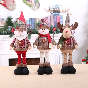 Three plush Christmas figurines with retractable legs featuring Santa, Snowman and Reindeer
