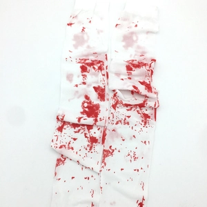 Detailed view of white Halloween stockings with realistic red blood splatter print