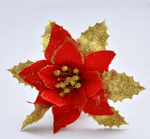 Detail of red Christmas poinsettia with gold glitter edges and yellow stamens