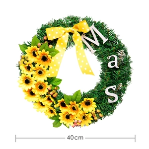 Artificial 40cm Christmas wreath with yellow sunflowers, berries and Mas letters
