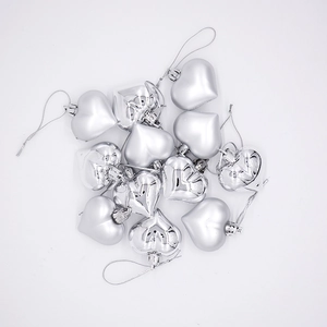 Silver heart-shaped ornaments with glossy and matte finishes for Christmas tree decoration