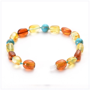 Detail of amber and turquoise beads with a secure screw clasp on a baby bracelet