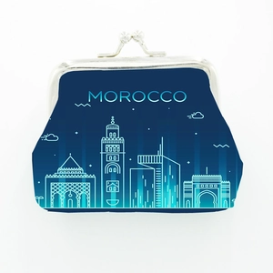 Close-up of Moroccan souvenir coin purse in navy blue with metal clasp and skyline
