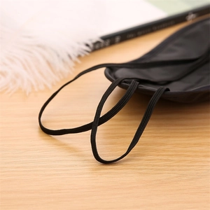 Breathable black sleep eye mask featuring dual elastic ear straps and silky fabric
