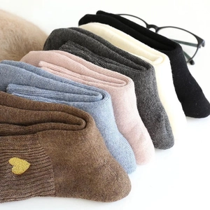 6 pairs of warm wool blend socks in assorted colors with gold heart embroidery details