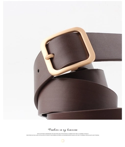 Detailed view of deep brown leather belt with square matte gold buckle for women