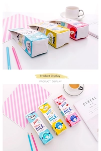 Detailed view of milk carton shaped pencil cases in blue, yellow and pink leather