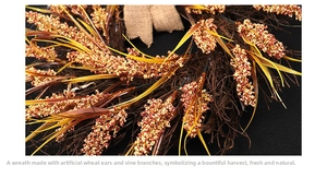 Detail of harvest wreath featuring golden wheat ears and a rustic burlap bow decoration