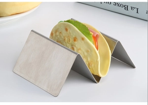 Detailed view of a stainless steel 2-slot taco holder with a filled taco on a clean surface