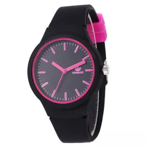 Detail of fashion silicone watch featuring a black strap and bright pink dial markers