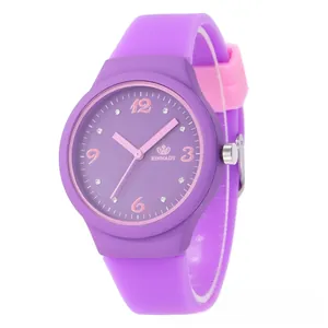 Detail of purple quartz watch dial with pink Arabic numerals and sparkling rhinestones