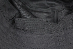 Detail view of cotton bucket hat inner sweatband and reinforced stitching texture