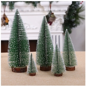 Close-up of five mini snowy cedar trees with natural wood bases for table decoration