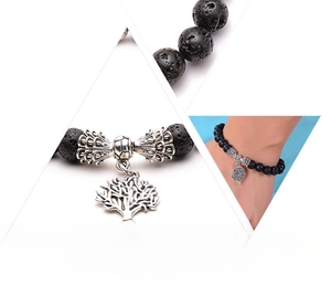 Macro detail and lifestyle view of a black lava rock bracelet with a silver tree charm