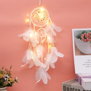 Detail of white dream catcher with glowing LED lights and decorative colorful beads
